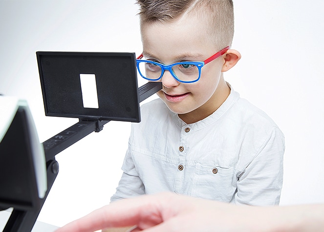 young boy getting an eye exam