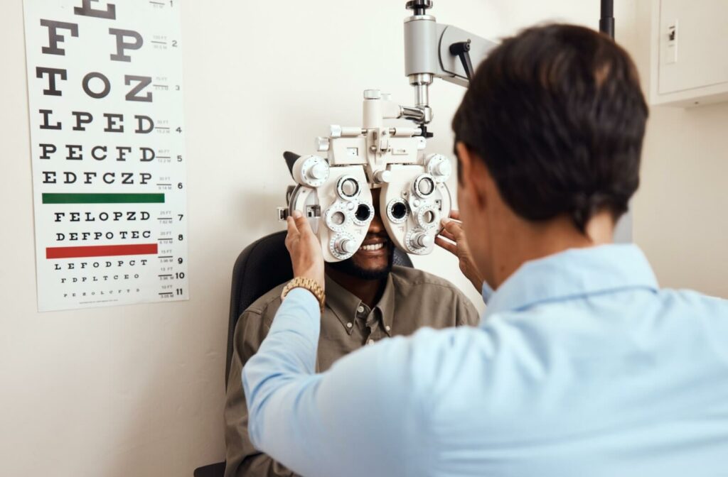 An optometrist uses a phoropter test to help their patient with myopia determine what glasses prescription they will need.