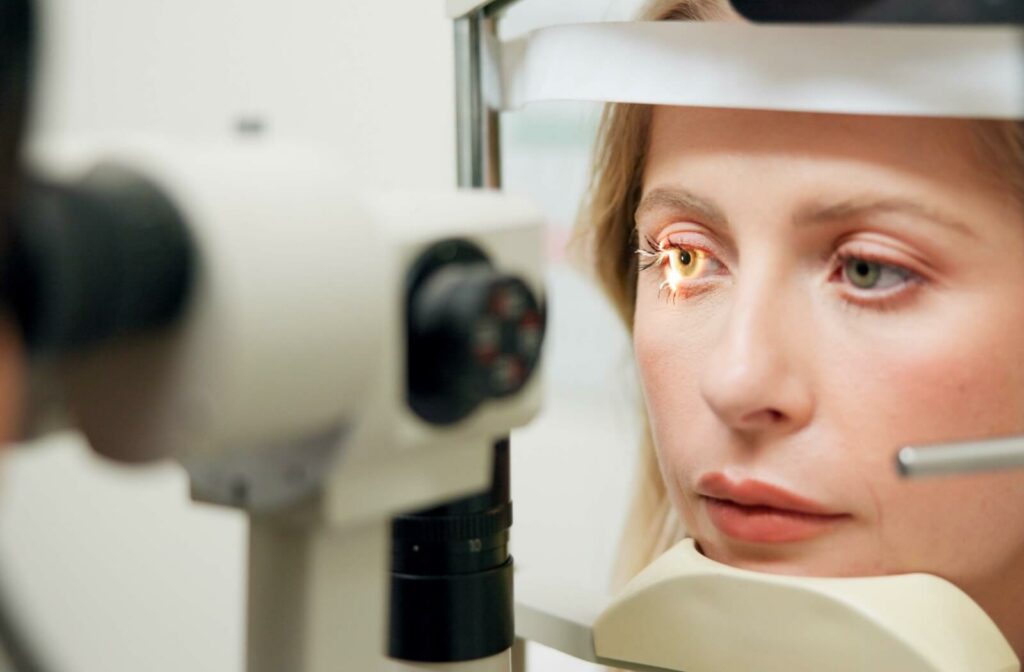 A close-up of a person undergoing a slit lamp eye exam.